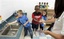 In this photo taken, Friday, Sept. 4, 2009, kindergarten teacher Marianna Ginn, right, of Raymond Elementary School, demonstrates the recommended use of antibacterial soap to her students, from left, Trey Holman, Jacob McGee and Shelby Bridgers as they wash their hands, Friday, Sept. 4, 2009