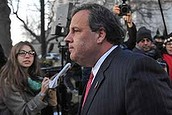 FILE - In this Thursday, Jan. 9, 2014, file photo, New Jersey Gov. Chris Christie walks past reporters as he leaves City Hall, in Fort Lee, N.J., after apologizing in person to Mayor Mark Sokolich. Moving quickly to contain a widening political scandal, Christie fired one of his top aides Thursday and apologized repeatedly for the 