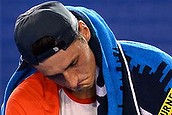 Tomic limps to first round exit (Thumbnail)