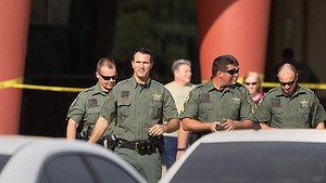 Pasco Sheriff Chris Nocco, front, says an argument between patrons over texting sparked a shooting that left one person dead and another injured in a Pasco County movie theatre.