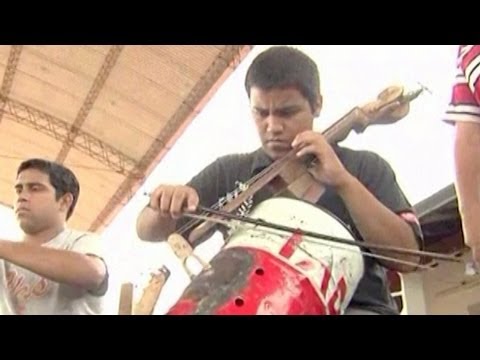 Children's Orchestra Play Instruments Made from Trash