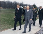 File - President Kennedy meeting with President Eisenhower, accompanied by military aides, Camp David, 22 April 1961