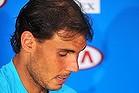 Rafael Nadal shows the blisters on his hand during a media conference after he won his fourth-round match against Kei Nishikori on Monday.