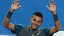 Australia's Nick Kyrgios joins the crowd and performs the mexican wave during his men's singles match against France's Benoit Paire on day four of the 2014 Australian Open tennis tournament in Melbourne on January 16, 2014. IMAGE RESTRICTED TO EDITORIAL USE - STRICTLY NO COMMERCIAL USE     AFP PHOTO / WILLIAM WEST