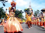 Senor Sto. Nino is lifted up by the lead dancer, as others lift up their props of bounty, during the Sinulog festival in Cebu City.