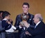 Real Madrid's world player Cristiano Ronaldo of Portugal, center, FIFA President Joseph Blatter and Ronaldo's son Ronaldo Junior stand together at the FIFA Ballon d'Or 2013