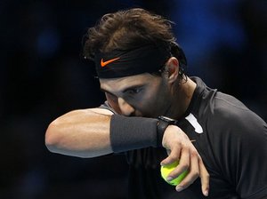 Rafael Nadal of Spain reacts during the round robin singles tennis match against Roger Federer of Switzerland at the ATP World Tour Finals at O2 Arena in London, Tuesday, Nov. 22, 2011.