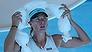 MELBOURNE, AUSTRALIA. - JANUARY 16:  Maria Sharapova of Russia cools off during a break in her second round match against Karin Knapp of Italy during day four of the 2014 Australian Open at Melbourne Park on January 16, 2014 in Melbourne, Australia.  (Photo by Clive Brunskill/Getty Images)