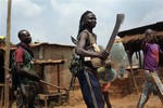 Anti-Balaka Christan youth loot the Muslim market in the PK13 district of Bangui, Central African Republic, Wednesday, Jan. 22, 2014.