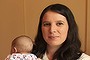 Fenella Cios, early childhood teacher and director of Fenella's family daycare in Mt Victoria with Ellie Graf aged 2 in purple top and her 9 week old son Oliver Cios on her lap. Mt Victoria, NSW.