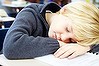 Portrait of a tired schoolboy sleeping during class. Generic girl; background; people; white; child; young; boy; girls; female; paper; male; school; kid; table; modern; person; life; portrait; little; cute; student; desk; sitting; concept; human; sleeping; books; class; dream; education; sleep; inside; classroom; stress; study; pressure; learn; Caucasian; dreaming; tired; lesson; knowledge; pupil; childhood; boring; schoolboy; elementary; primary; schoolchild; classmate. Istock. 100801.