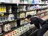 File photo of a man checking prices in a supermarket