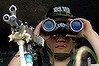 TO GO WITH: NKorea-SKorea-military-IT-Microsoft-offbeat(FILES) A South Korean soldier keeps vigil at an observation point, on the southern side of the demilitarized zone (DMZ), Paju, 07 July 2006.  Microsoft's movement-recognition Kinect software has morphed from virtual shooter gaming to the real-life challenge of guarding the world's last Cold War border. The sensor allowing hands-free play on the Xbox is the basis for a security device now deployed along the demilitarised zone (DMZ) that separates North and South Korea, after being adapted by a South Korean programmer.      AFP PHOTO/JUNG YEON-JE