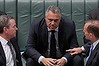 Leader of the House Christopher Pyne, Treasurer Joe Hockey and Prime Minister Tony Abbott in discussion during Question Time at Parliament House in Canberra on Thursday 12 December 2013. Photo: Alex Ellinghausen