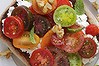 Heirloom tomato bruschetta with labne and walnuts.