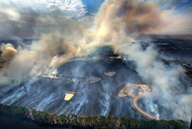 Houses under threat as a fire moves through Romsey on the outskirts of Melbourne which was photographed from the air in a helicopter.
Photograph Simon O'Dwyer. Fairfax Media. February 9th 2014