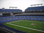 M&T Bank Stadium is a multi-purpose football stadium located in Baltimore, Maryland. It is the home of the Baltimore Ravens of the National Football League. The stadium is immediately adjacent to Oriole Park at Camden Yards, the home of the Baltimore Orioles. Served by the Hamburg Street station of the Baltimore Light Rail, the stadium originally featured a natural grass surface. However, an artificial surface, Sportexe Momentum Turf, was installed for the 2003 season.