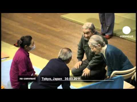 Japan's Emperor Akihito visits tsunami victims - no comment