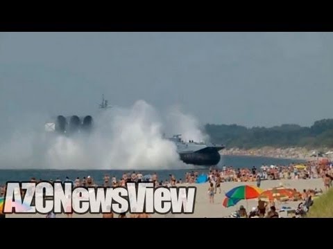 Russian Navy Hovercraft Lands On Busy Beach