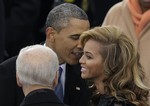 President Barack Obama talks to Beyonce before she sings the National Anthem at his ceremonial swearing-in at the U.S. Capitol during the 57th Presidential Inauguration in Washington, Monday, Jan. 21, 2013.