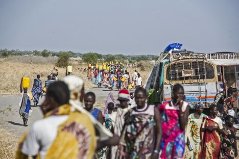 File - Due to a severe water shortage at the camp for internally displaced persons (IDPs) in the UN Mission for South Sudan's (UNMISS) Malakal Base, women walk in groups to fetch water from the Nile River, located approximately three kilometres from camp, 24 January, 2014.