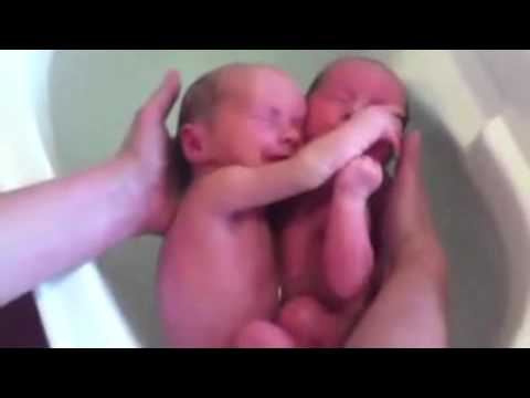 Cute Baby Bath Spa - Newborn Twins Hugging Each Other