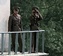  North Korean soldiers watch a repatriation ceremony from a tower on the North Korean side Military Demarkation Line (MDL). During the ceremony the remains of what is believed to be five U.S. soldiers that served in the Korean war were returned to the Sou