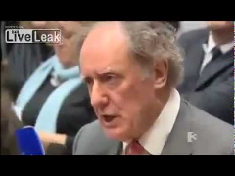 irish journalist shames ECB banker with tough questions on irelands debt.