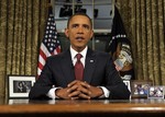 President Barack Obama reads his speech to photographers after delivering a primetime televised address marking the the end of combat mission in Iraq from the Oval Office of the White House in Washington, Tuesday, Aug. 31, 2010. (AP Photo/Susan Walsh)