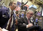 Traders work on the floor of the New York Stock Exchange Wednesday, April 28, 2010