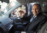 Algerian President Abdelaziz Bouteflika waves as he arrives at his campaign headquarters in the Hydra district of Algiers, Friday April 10, 2009, a day after the Algerian presidential election.