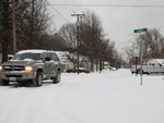 A road in Pocahontas, Illinois, USA is covered with snow during a winter storm as seen on this February 2, 2013 photo.