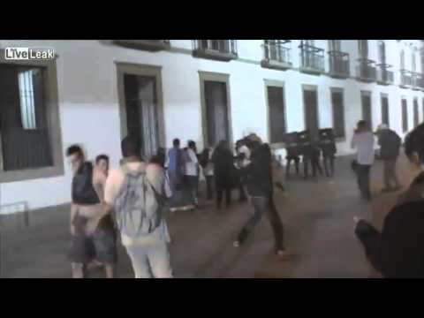 Rio Brazil Riots 2013. Cop getting beaten up by protesters.