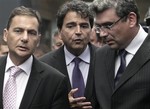 French Minister of Immigration Eric Besson, left, walks with Romanian Foreign Minister Teodor Baconschi, right, as French State Secretary for European Affaires Pierre Lellouche, center, gestures prior to a joint press conference in Bucharest, Romania, Thursday, Sept. 9, 2010.