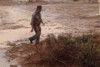 A muddy Barnaby Joyce on the PM's drought tour at Bourke.