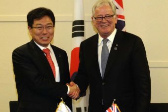 Andrew Robb and He Yoon Sang-jick