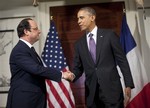 President Barack Obama, right, and French President Francois Hollande, left, shake hands after talking with the media following their tour of Monticello, President Thomas Jefferson’s estate, Monday, Feb. 10, 2014, in Charlottesville, Va.