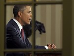 President Barack Obama, photographed from the Rose Garden, delivers a primetime televised address marking the the end of combat mission in Iraq from the Oval Office of the White House in Washington, Tuesday, Aug. 31, 2010.