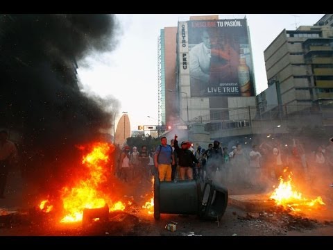 Video courtesy: Telesur
At least three people have died in violent protests in the Venezuelan capital, officials have confirmed. President Nicolas Maduro has condemned the unrest as an attempt at a coup d\'état orchestrated by extremist members of the political opposition. READ MORE: http://on.rt.com/5pf7e6

RT LIVE http://rt.com/on-air

Subscribe to RT! http://www.youtube.com/subscription_center?add_user=RussiaToday

Like us on Facebook http://www.facebook.com/RTnews
Follow us on Twitter http://twitter.com/RT_com
Follow us on Instagram http://instagram.com/rt
Follow us on Google+ http://plus.google.com/+RT

RT (Russia Today) is a global news network broadcasting from Moscow and Washington studios. RT is the first news channel to break the 1 billion YouTube views benchmark.