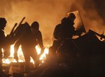 Anti-government protesters clash with riot police in Kiev's Independence Square, the epicenter of the country's current unrest, in Ukraine, Wednesday, Feb. 19, 2014.