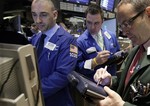 Traders work on the floor of the New York Stock Exchange Monday, April 12, 2010.