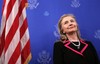 Secretary of State Hillary Rodham Clinton listens as she is introduced prior to speaking at the residence of the U.S. ambassador to Belgium in Brussels