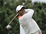 Tiger Woods watches his tee shot on the fourth hole of the South Course at Torrey Pines during the first round of the Farmers Insurance Open golf tournament Thursday Jan. 24, 2013 in San Diego.