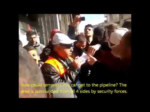 Ar-Rastan, Homs. [3 Jan 2012]. Arab observer listens to pipeline bombing witnesses.