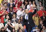 President Barack Obama waves as he is introduced before he delivers remarks on health insurance reform during his event at George Mason University in Fairfax, Va., Friday, March 19, 2010.