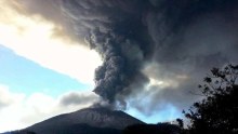 Chaparrastique volcano spews ash and smoke.