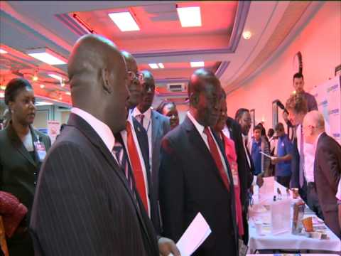 Vice President inspecting PostBank's stall at the 3rd Ugandan UK Trade - Ugandan UK Convention