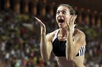 Russia's Yelena Isinbayeva reacts after breaking the world record with 5.04 meters during the pole vault event at the Monaco Grand Prix international athletics meeting in Monaco, Tuesday, July 29, 2008. 