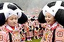 Ethnic Miao women with headwear are seen during their annual Tiaohua festival in Suoga village, Guizhou province.  During the festival, young women dance and play traditional instruments while men visit around nearby villages to seek for their beloved.