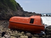 A lifeboat is washed up on the coast of south Java